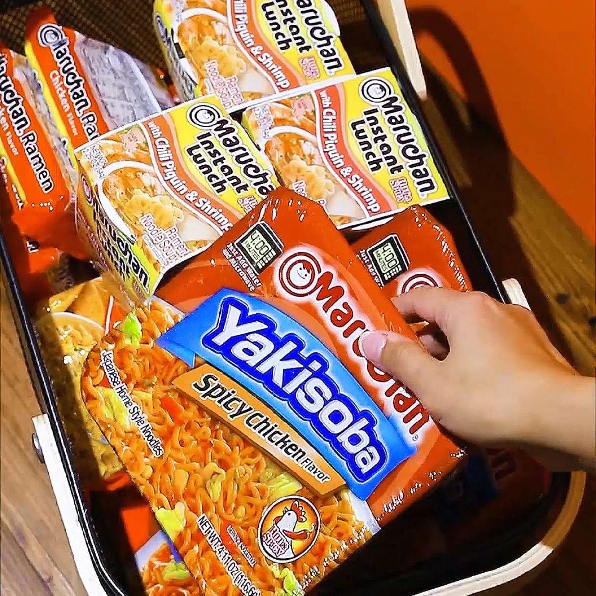 Packages of Maruchan ramen products in a cart