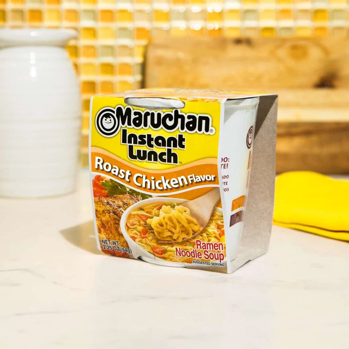 Package of instant lunch roast chicken flavor on a counter