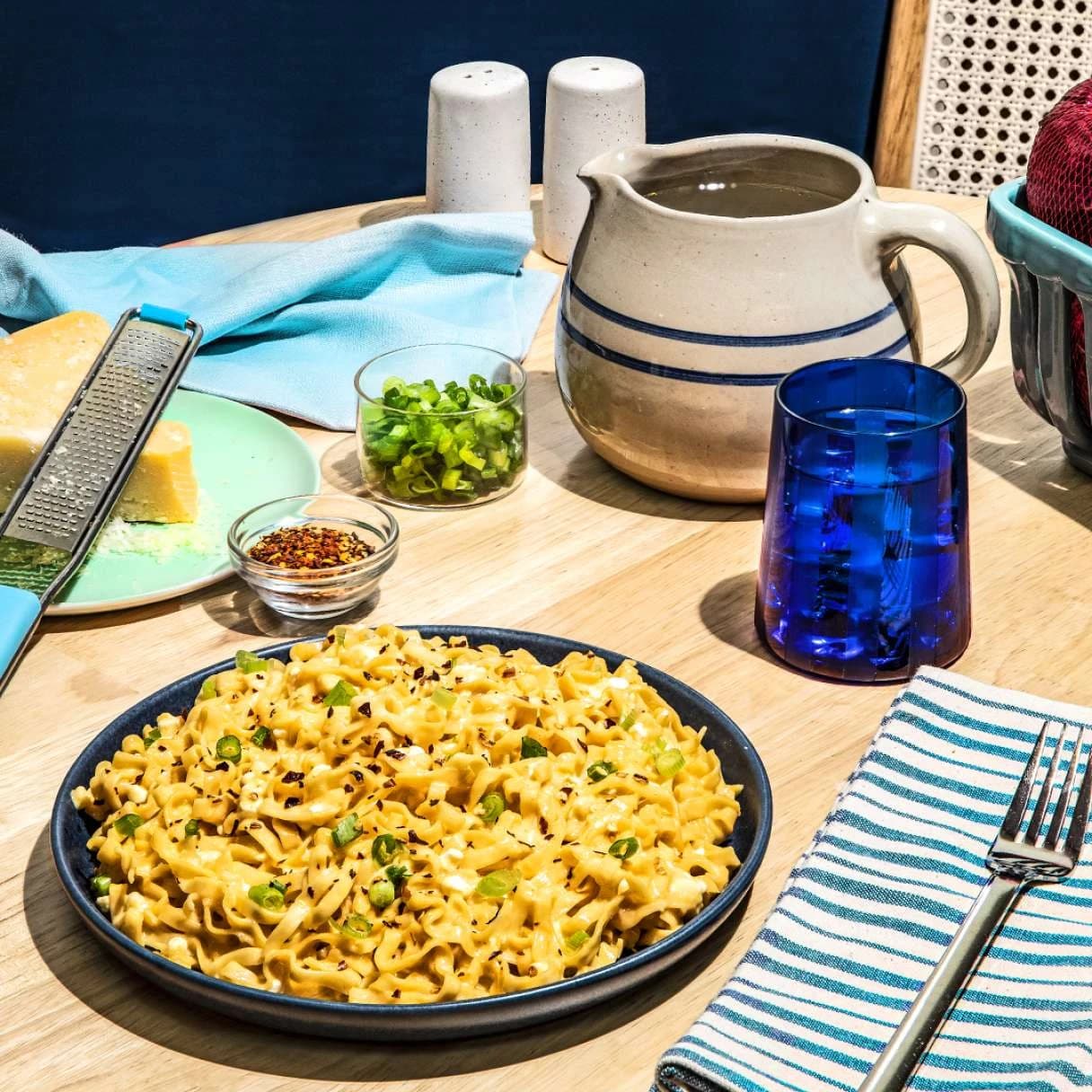 Cheddar cheese flavor yakisoba in a bowl on a dining table